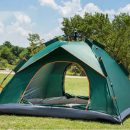 Forest green camping tent for 3 to 4 people set up outdoors